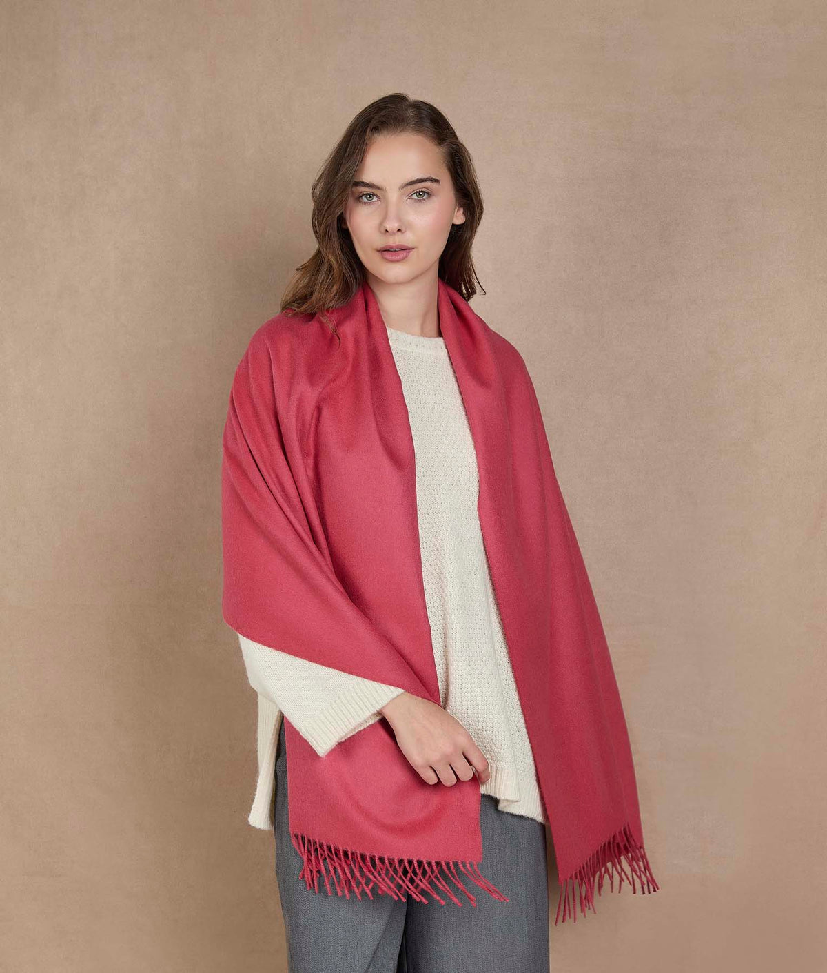 Woman wearing a pink scarf.